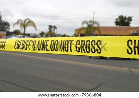 Genuine "Sheriff's Line Do Not Cross" caution tape collected from the scene of a murder.