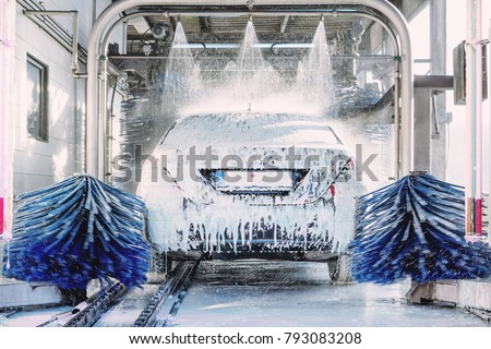 detail view on car wash, car wash foam water, Automatic car wash in action Royalty-Free Stock Photo #793083208