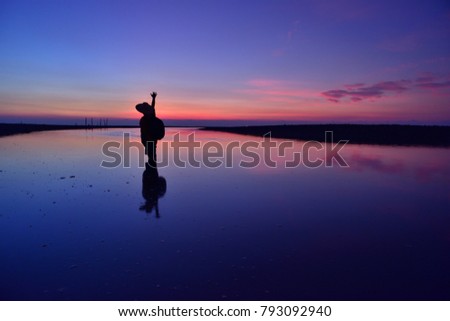 Taiwan seaside wetlands reflection sunrise and sunset red clouds Rays of light and light Beautiful view.