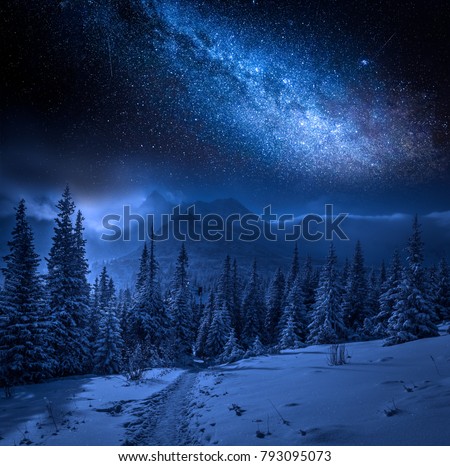 Milky way and Tatras Mountains in winter at night, Poland