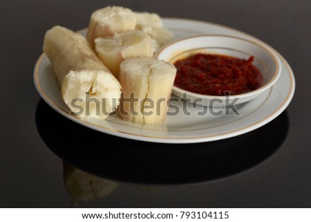 steam tapioca with  dipped  sambal. In Malaysia this food called"Ubi Rebus" one  of traditional malay food cultural