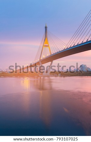 Night suspension bridge with after sunset skyline