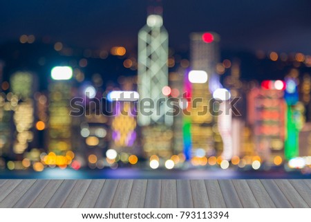 Opening wooden floor, Night blurred light Hong Kong business downtown, abstract background