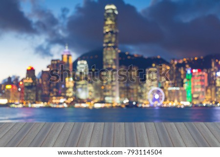 Opening wooden floor, Hong Kong night blurred bokeh light central business downtown, abstract background