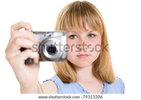 A teenager with a camera on a white background.