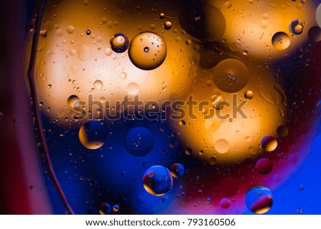 Orange and blue bokeh abstract background color from oil and water.
