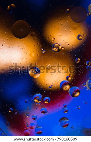 Orange and blue bokeh abstract background color from oil and water.
