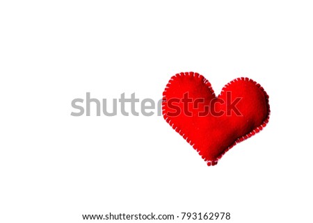 The shiny single red fabric heart on the middle of right side isolated on white background, free space for texts in the left side. Concept Valentine's day or Wedding and love forever.