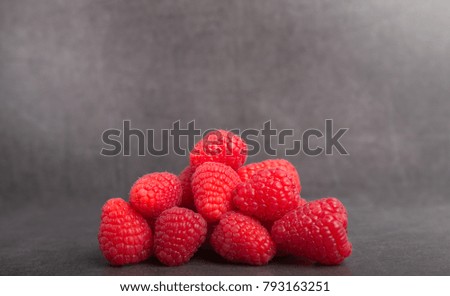 raspberryâ??s on a grey stone table