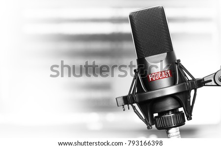Professional microphone with podcast logo on a stand in radio studio  Royalty-Free Stock Photo #793166398