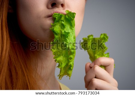  woman eating a salad                              