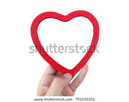 Man hand holding red heart wooden frame isolated background