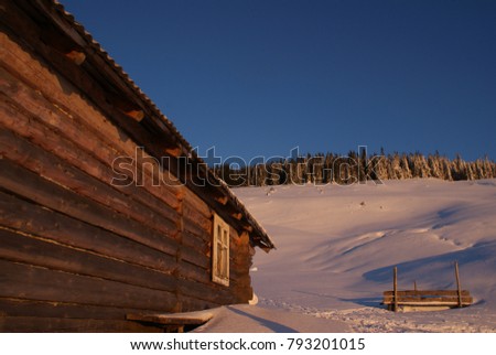 Wooden house in Carpathian mountains in winter