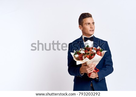  man with a bouquet of fruits                              