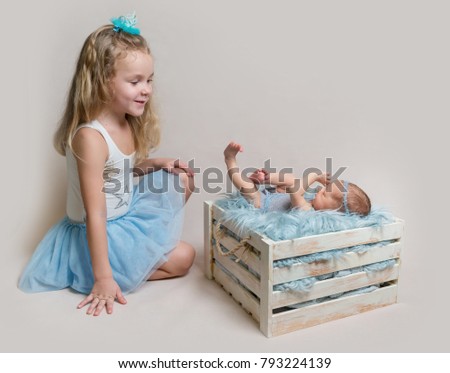 Little girl and her newborn sister