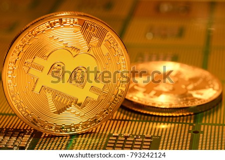close up of crypto currency phisical bitcoin over computer cpu. background and business concept image.