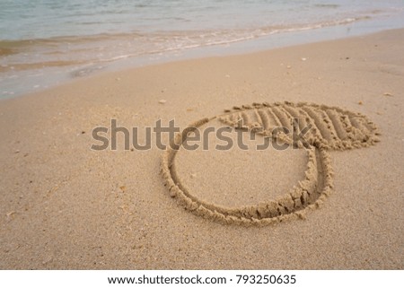 Hearts images was written by hand on a beach by the sea. The picture represents our commitment of love.