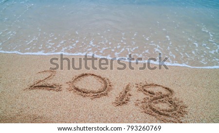 Sand beach with ocean waves  ,Write a message Happy New Year 2018