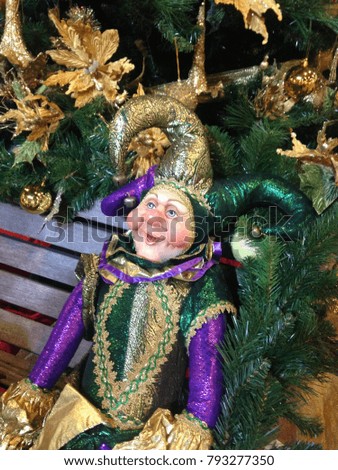 Joker Doll isolated on Christmas Tree background