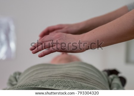 hands of professional healer doing  treatment, bio-energy, reiki, channeling energy Royalty-Free Stock Photo #793304320
