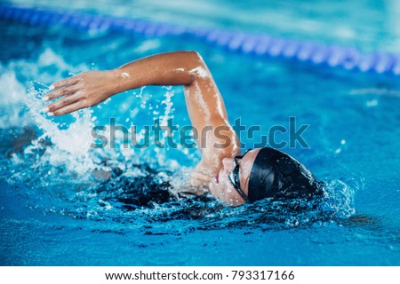 Professional swimmer, swimming race, indoor pool Royalty-Free Stock Photo #793317166