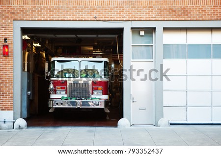 Fire truck in fire station. Royalty-Free Stock Photo #793352437