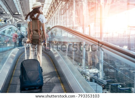 Young Asian is passenger at the international airport. Royalty-Free Stock Photo #793353103
