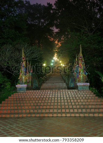 Bigger snake statue is believe in Heavenly walk. A way up the stairs in Thailand temple at Wat Phrathat Doi Suthep in Chiang Mai