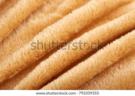 Texture of brown fluffy soft plush. Towel terry cloth, Soft texture cloth