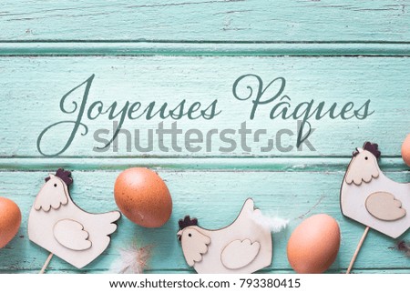 Easter Eggs background, written in French "Joyeuses Pâques" 
