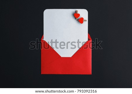 letter with congratulations on a black background with hearts and doves, red envelope concept valentine's day