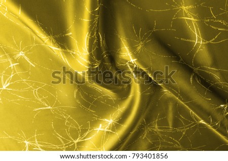 texture Silk fabric Golden yellow with a pattern. Add an unexpected shine of sophistication when introducing this mustard velvet. Soft light velvet depicts a playfully twirled design in decadent gold.