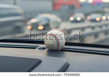 baseball ball in car interior