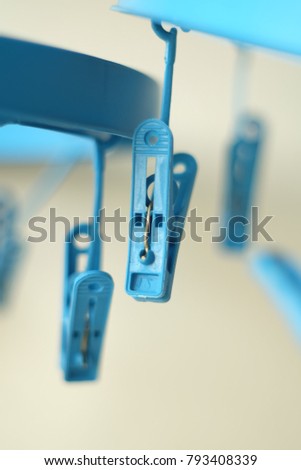 Close up blue plastic cloth clamp.
