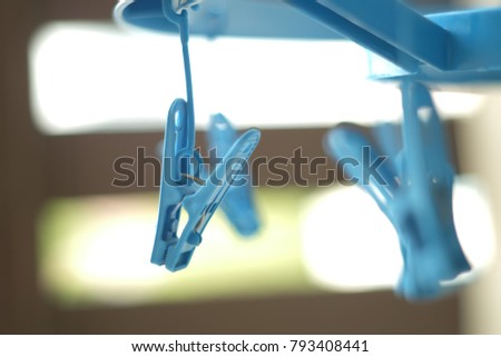 Close up blue plastic cloth clamp.