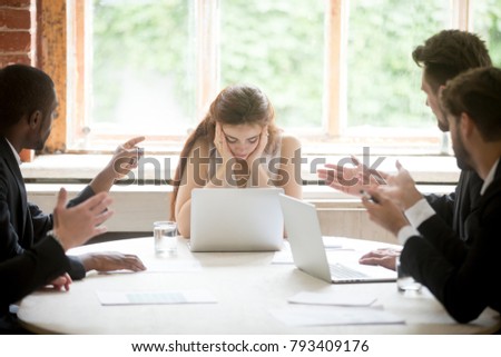 Male colleagues pointing fingers at upset female boss on meeting, tired sad woman leader experiencing gender discrimination at work, businessmen blaming bullying depressed businesswoman for mistake Royalty-Free Stock Photo #793409176