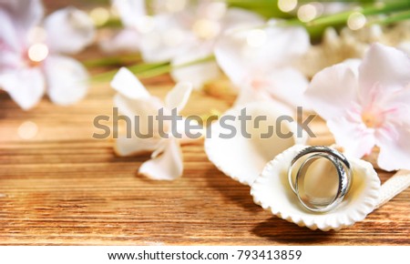 Wedding ring on the sea shell