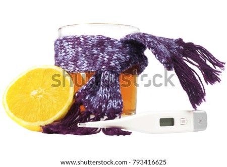 Thermometer, tea and lemon on a white background