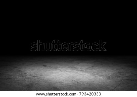 Dark room with concrete floors and spotlights. Royalty-Free Stock Photo #793420333