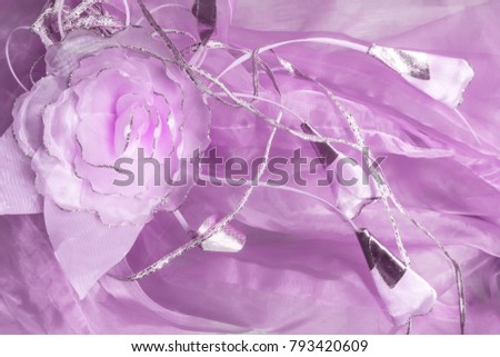 Texture of wedding festive decor on a silk dress close-up with copy space in trendy color