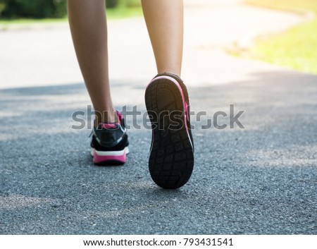 Running in summer day on the road concept for exercising and healthy