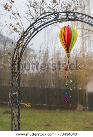 Colorful paper lantern with spiral on a misty day in winter