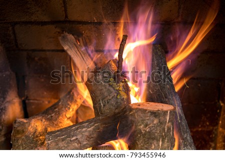 Burning logs in a fireplace