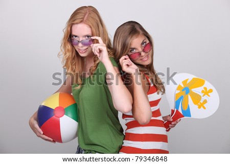 Studio shot of teenage girls with beachballs