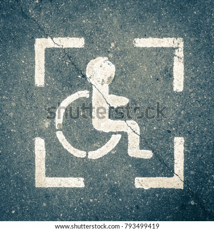 Parking sign for disabled people on asphalt