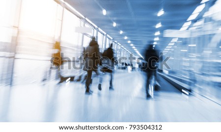 trade fair visitors walking in a clean futuristic corridor