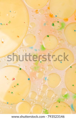 Drops of vegetable oil on liquid, abstract background, pop art texture, yellow circles on a light background, minimalism, pastel pattern, art