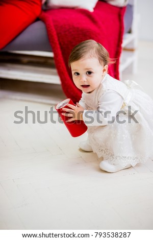 Funny little girl in white dress