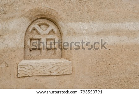 window cartoon style pattern on sand surface.