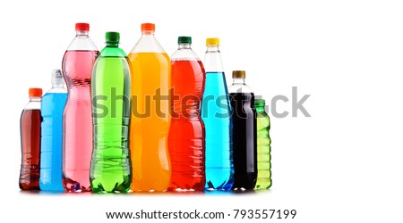 Plastic bottles of assorted carbonated soft drinks over white background Royalty-Free Stock Photo #793557199
